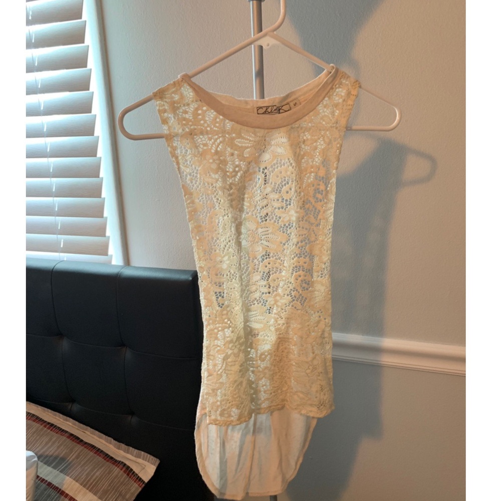 Cream tank top with cool back details